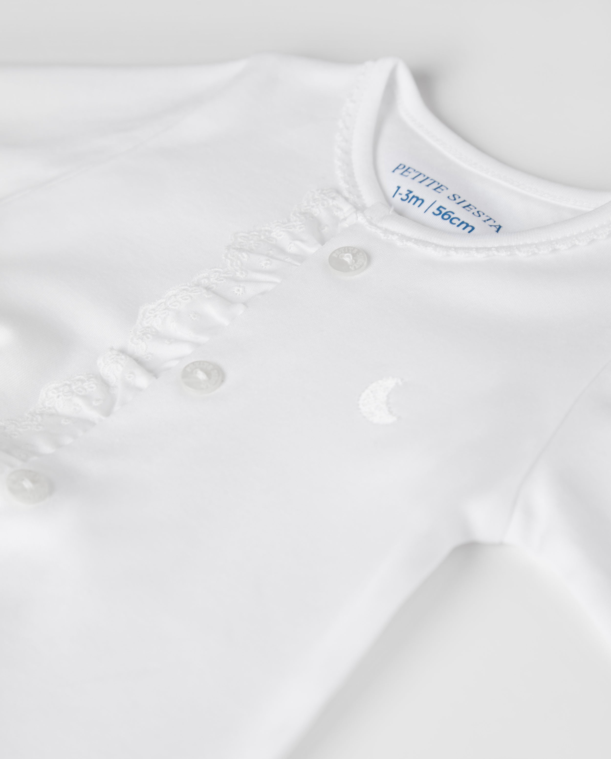 Pyjama bébé à rayures blanches brodées