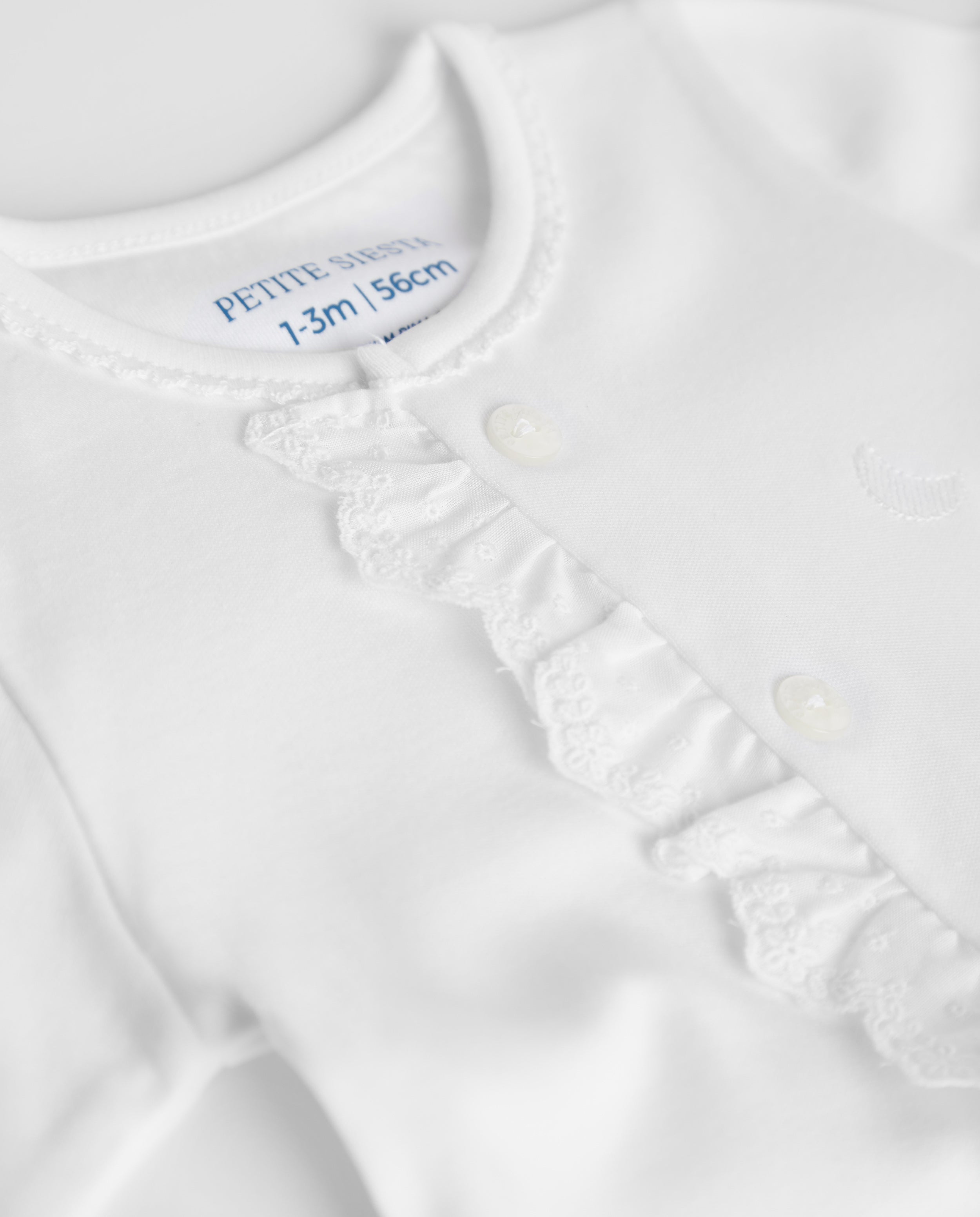 Pyjama bébé à rayures blanches brodées