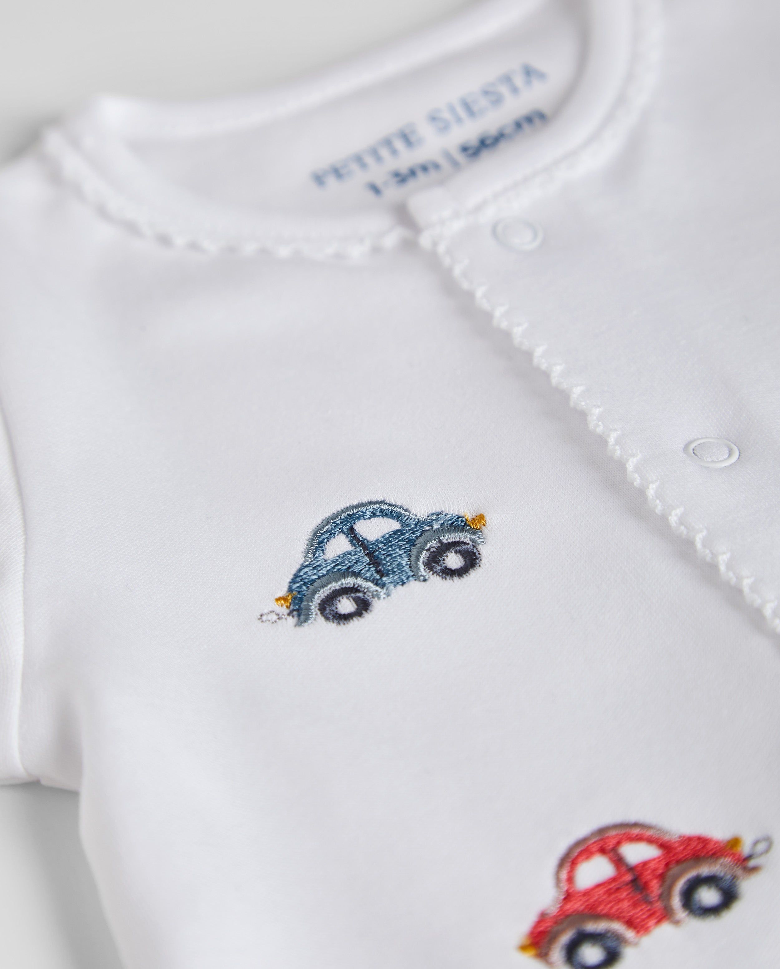 White Baby Pajamas Signs